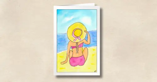 A Beach Besties beach-themed card featuring a woman in a pink swimsuit with a braid and yellow hat looking out over the ocean, on a sandy-colored background.