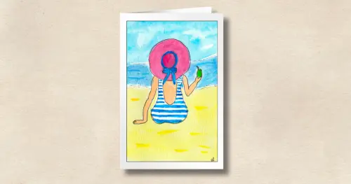 A Beach Besties beach-themed card featuring a woman in a blue striped swimsuit with a beverage and pink hat looking out over the ocean, on a sandy-colored background.