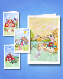 Blossom Pie's four Warm Summer Comforts card set on a blue background. Each hand-designed card print shows a different cozy home.